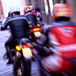 People riding scooters